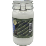 1L glass jar of Niugini Organics Virgin Coconut Oil with a clip-top lid on a plain white background.