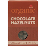 Organic Times 150g box of milk chocolate hazelnuts on a white background with product branding and organic logos.