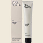 Peg Paste Sacred Clove 100g toothpaste tube and box with hydroxyapatite on a white background.