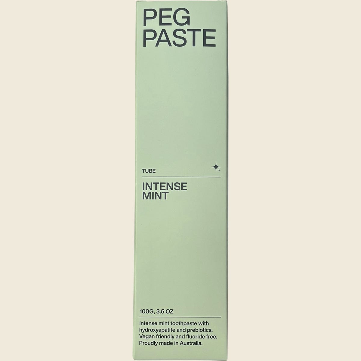 Front of Peg Paste Intense Mint 100g toothpaste box with green and white text on a white background.
