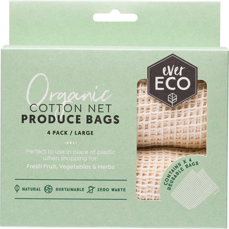 Four large organic cotton net produce bags with drawstring closures for plastic-free shopping.