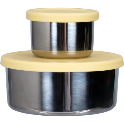 Two nested stainless steel snack pods with yellow silicone lids on a white background.