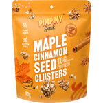 80g bag of Pimp My Snack Maple Cinnamon Seeds showing sunflower and pumpkin seeds with a cinnamon stick.