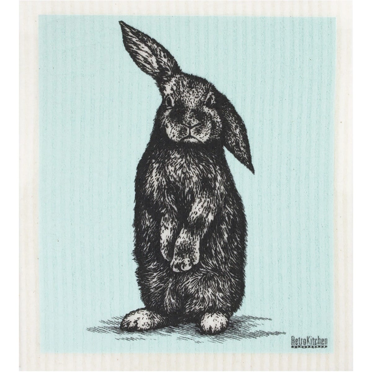 Compostable sponge cloth with a black and white rabbit design on a textured off-white background.
