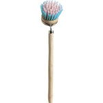 Retro-inspired dish brush with a long timber handle and soft, colorful nylon bristles on a white background.