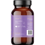 An amber glass supplement bottle with a black cap, showing the back of the label which is lavender purple with gold text and icons. The label includes text for 'Magnesium glycinate' and a barcode.