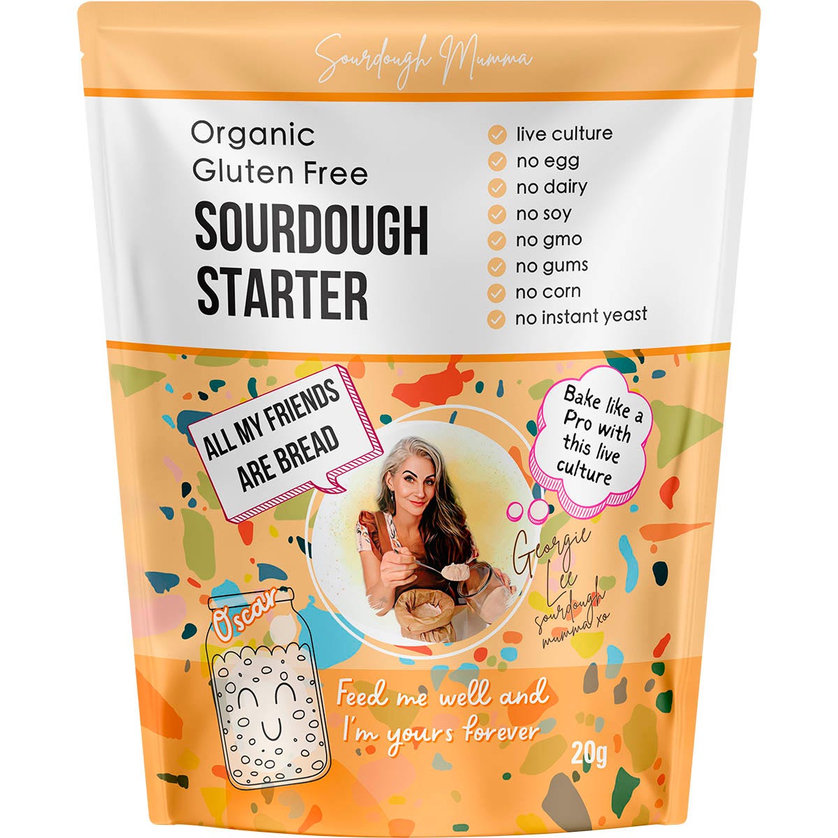 Sourdough Mumma 20g gluten-free sourdough starter packet on a marble surface with a glass jar of bubbly starter.
