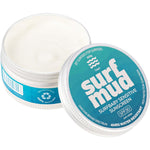 Open 100g tin of Surfmud Surfbaby Sensitive Sunscreen SPF 30 revealing the creamy white mineral formula inside.
