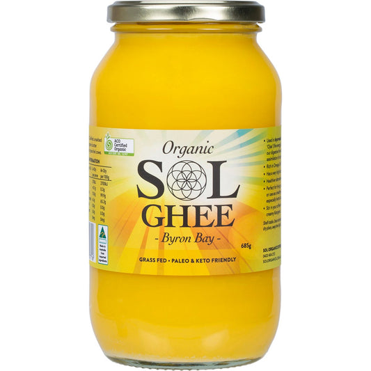 A 685g jar of Sol Organics Organic Ghee made from grass-fed cows, featuring a yellow label and lid.