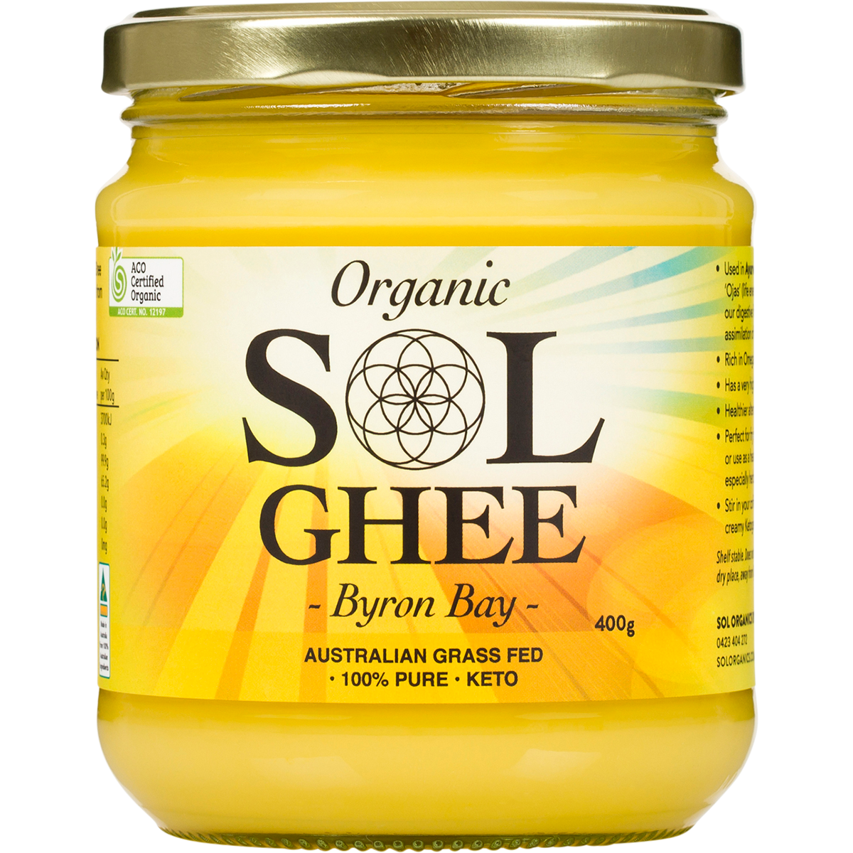 A jar of Organic Sol Ghee by Byron Bay, featuring a golden-yellow ghee inside a clear glass jar with a metallic gold lid and a white and yellow label.