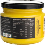 A 275g glass jar of Sol Organics Turmeric Super Ghee shown at an angle, highlighting its yellow and brown label.