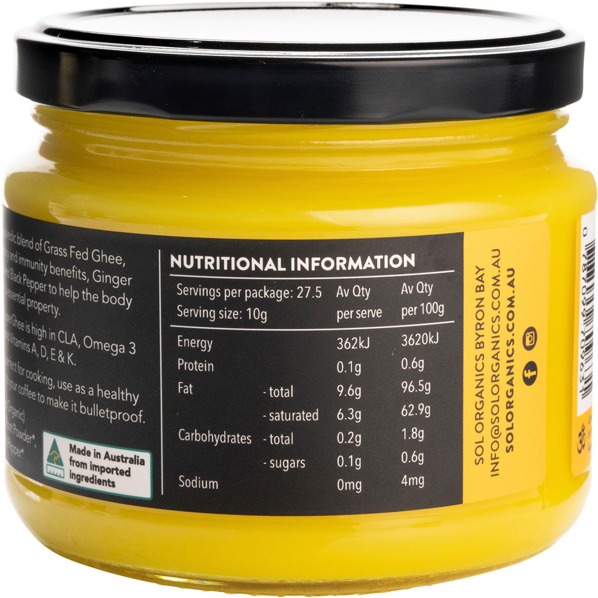 A 275g glass jar of Sol Organics Turmeric Super Ghee shown at an angle, highlighting its yellow and brown label.