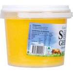Side view of a 1kg tub of Sol Organics Grass Fed Ghee on a white background.