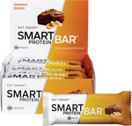 Banana bread flavor Smart Protein Bar 12-pack box with a single bar and sliced banana pieces.