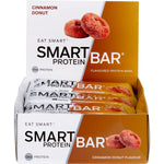 Side view of a 12pack box of Smart Protein Bar Cinnamon Donut showing a bar and a pile of cinnamon sugar.