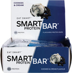 Open retail display box filled with individually wrapped Cookies & Cream Smart Protein Bars.