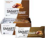 Peanut Choc Caramel Smart Protein Bar 12-pack box with an individual 60g bar and loose peanuts on a white background.