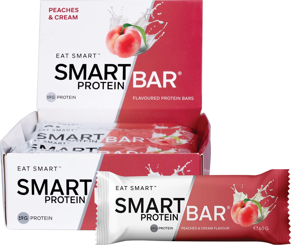 Smart Protein Bar Peaches and Cream 60g pack of 12 with a display box and an unwrapped bar showing a soft peach-colored texture.