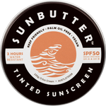 SunButter SPF50 Tinted Sunscreen in a 100g plastic-free tin with a sunset and ocean design.