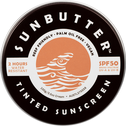 SunButter SPF50 Tinted Sunscreen in a 100g plastic-free tin with a sunset and ocean design.