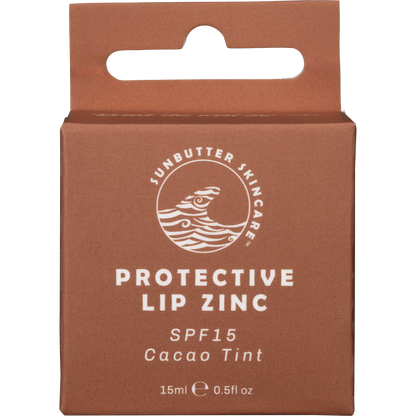 Small circular metal tin of SunButter Cacao Lip Zinc with a brown and white label.