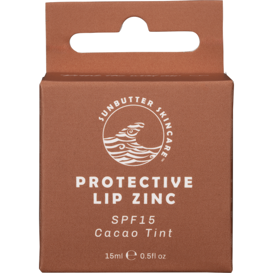 Small circular metal tin of SunButter Cacao Lip Zinc with a brown and white label.