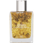 Summer Salt Body 100ml face and body oil bottle with 24K gold flakes, chamomile flowers, and citrine quartz.