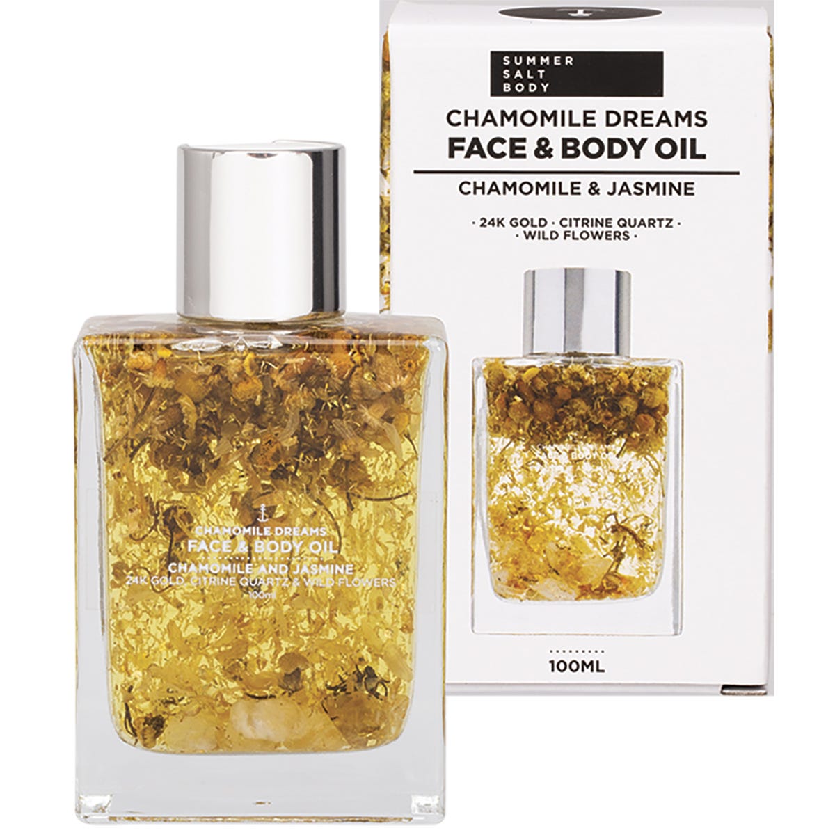Summer Salt Body 24K gold face and body oil bottle with chamomile flowers and citrine quartz next to its gift box.