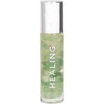 Summer Salt Body 24K Gold Healing essential oil roller with aventurine crystals on a white background.