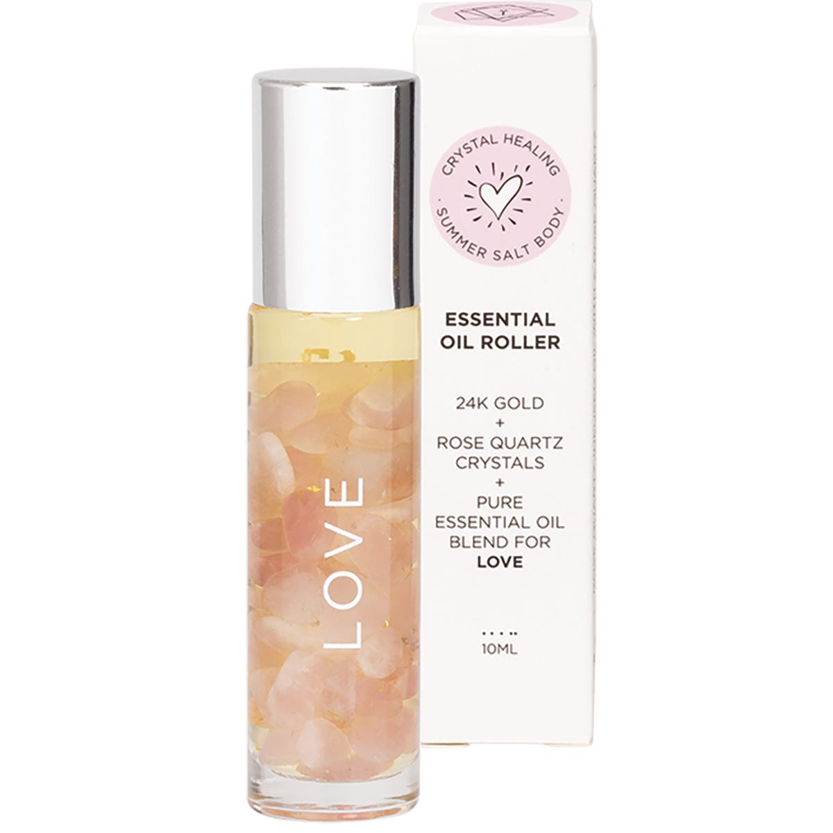 Essential oil roller with rose quartz and 24K gold flakes next to its matching pink and gold box.
