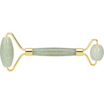 Green jade crystal facial roller with gold-toned hardware on a white background.