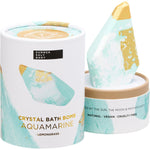 Aquamarine crystal bath bomb shown inside its open blue and white patterned retail box on a white background.