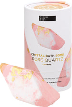 Rose Quartz Jasmine bath bomb shown next to its pink and white box with floral and gold foil details.