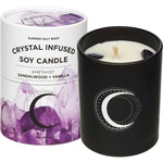 Amethyst-infused soy candle in a glass jar next to its box, featuring sandalwood and vanilla scents.