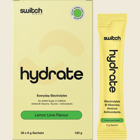 Box of 20 lemon lime Hydrate Switch electrolyte sachets shown with a single sachet and a glass of water.