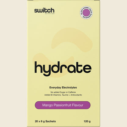 Single Mango Passionfruit Switch Nutrition Hydrate electrolyte sachet next to a glass of orange drink.