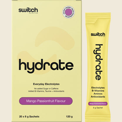 Switch Nutrition Hydrate Mango Passionfruit 20-pack box and single sachet with a glass of orange electrolyte drink.