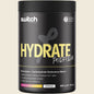600g tub of Switch Nutrition Hydrate Perform Raspberry Lemonade electrolytes and carbs powder on a white background.