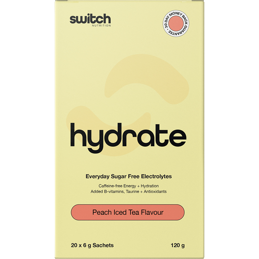 Box of 20 Switch Nutrition Peach Iced Tea sugar-free electrolyte sachets with a glass of tea and peach slices.