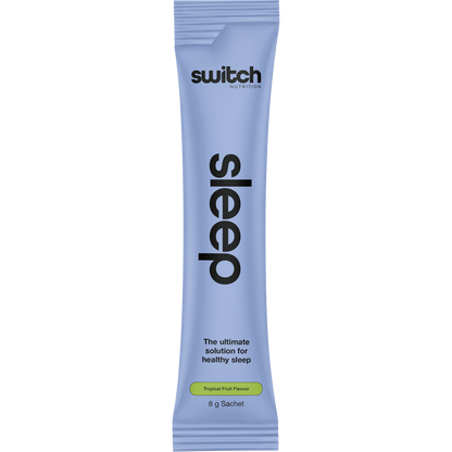 Side view of a Switch Nutrition Sleep+ Tropical Fruit sachet box showing product benefits and a vegan-friendly logo.