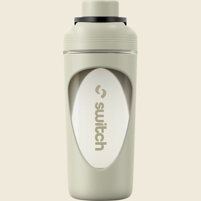Sage green 800ml Switch Nutrition shaker bottle with a black lid, flip cap, and internal blender ball.