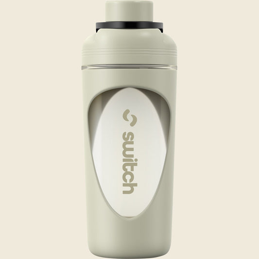Sage green 800ml Switch Nutrition shaker bottle with a black lid, flip cap, and internal blender ball.