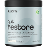 A container of Switch Nutrition Gut Restore supplement powder, featuring a light blue and white label with a black lid, set against a solid beige background.