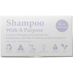 Shampoo With A Purpose bar for dry or damaged hair in white packaging with purple and blue floral accents.