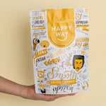 Happy Way Salted Caramel Vegan Protein Powder 500g bag with a scoop of light brown powder and loose sea salt pieces.