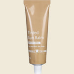 70ml tub of Thrive Tallow Tinted Sun Balm with Zinc featuring a natural, grass-fed formula on a white background.