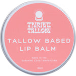 Thrive Tallow 35ml lip balm in a silver metal tin featuring a minimalist label and a brown leaf logo.