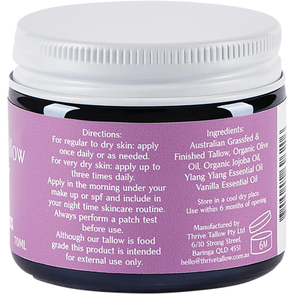 Side view of a glass jar of Thrive Tallow Whipped Tallow Moisturiser with a black lid on a white background.