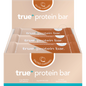 Box of 12 True Protein Salted Caramel bars in a beige display box with one individually wrapped bar in front.