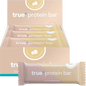 Toasted Coconut True Protein Bar shown as a single wrapped 63g bar next to its display box of 12.
